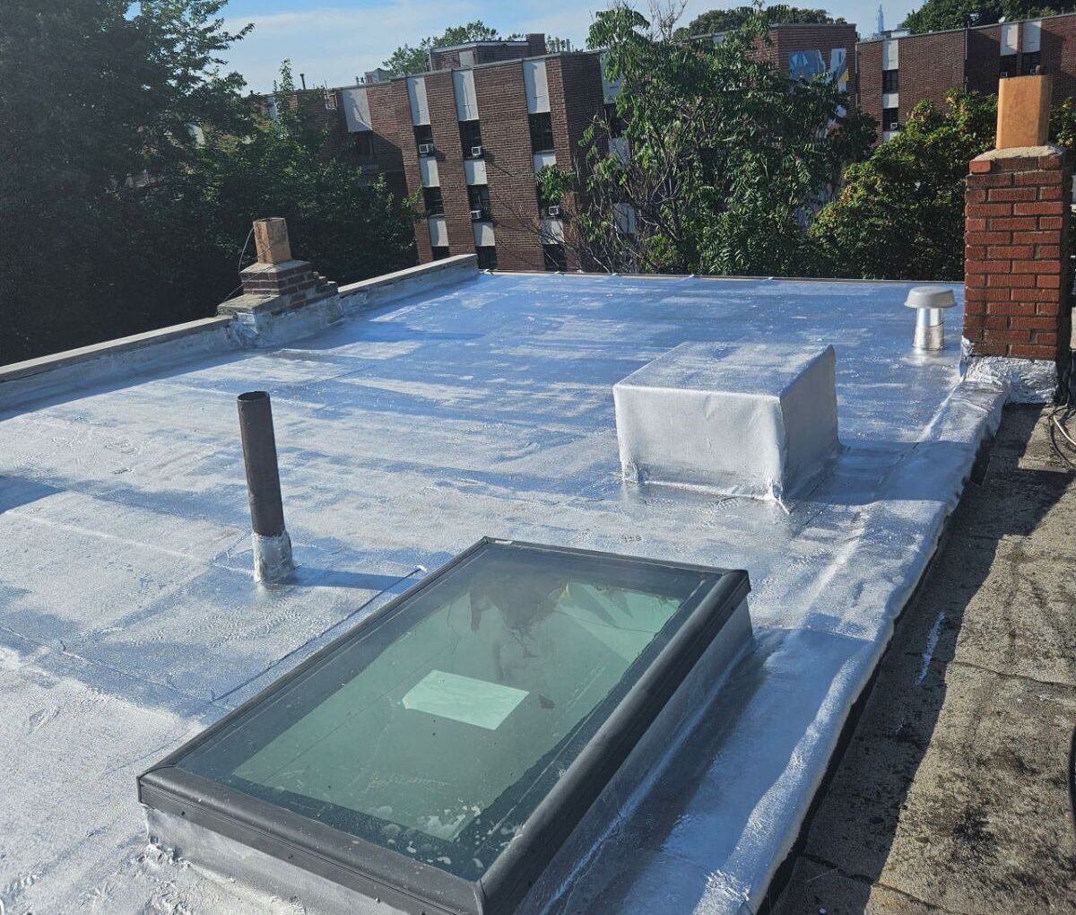 White TPO roofing system installed on flat roof in NYC