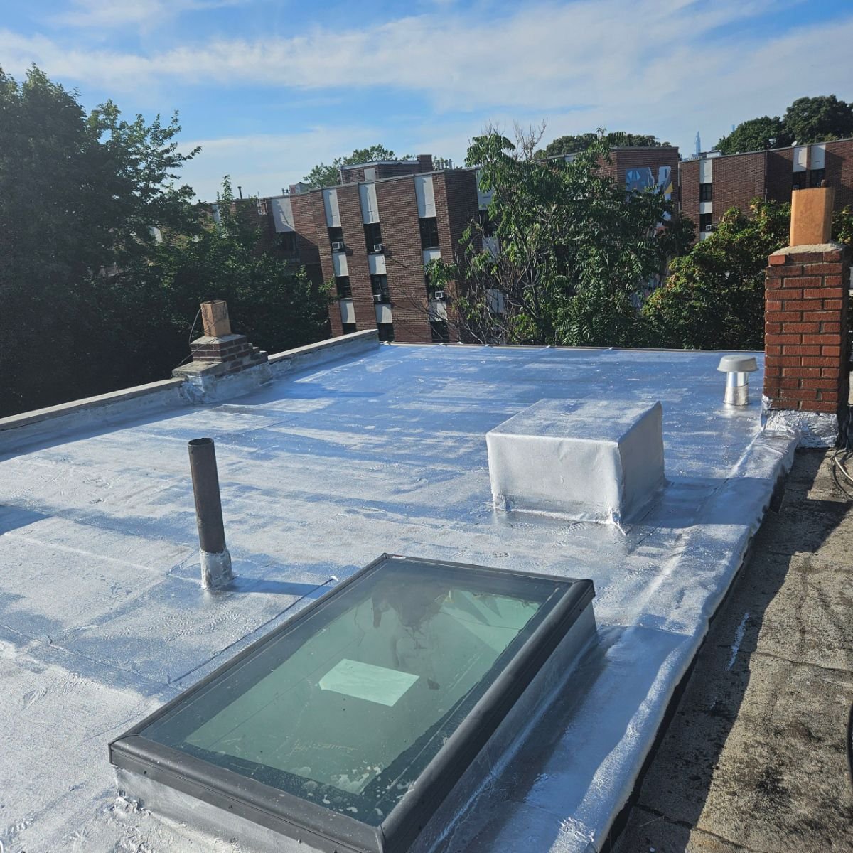 White TPO roofing system installed on flat roof in NYC