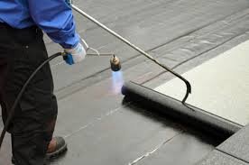 EPDM rubber roofing installation on flat roof in NYC